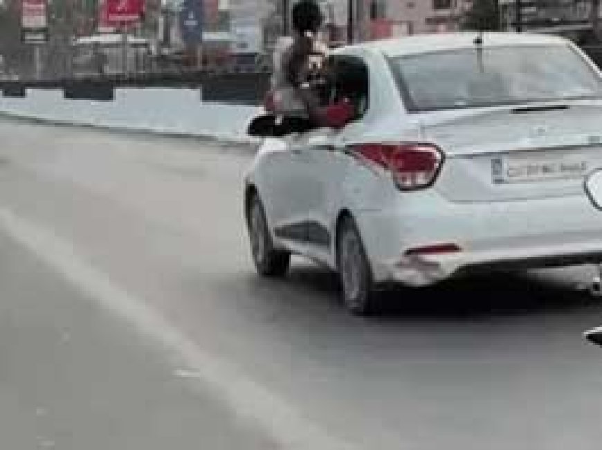 चलती कार में स्टंट करने का VIDEO:युवती खिड़की से निकलकर बनवा रही थी वीडियो, बीएसपी ऑफिसर चला रहा था कार; अब 2800 का चालान